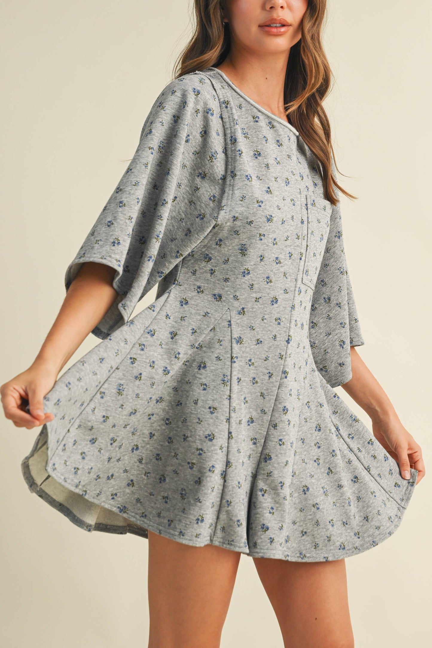 FLORAL FRONT POCKET GODET FLOWY ROMPER