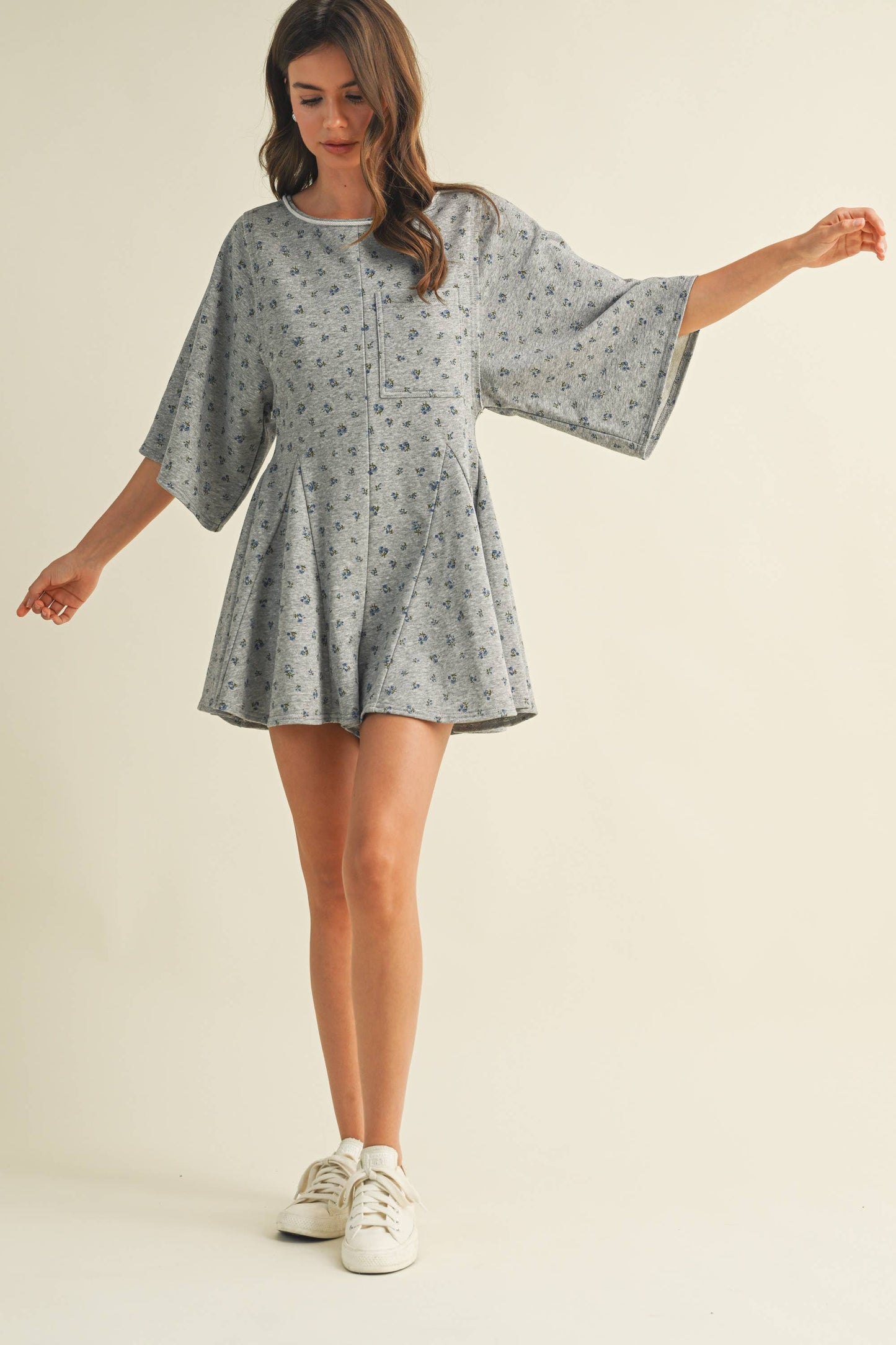 FLORAL FRONT POCKET GODET FLOWY ROMPER
